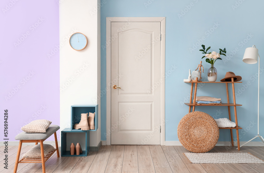 Interior of hall with flowers in vase on shelving unit