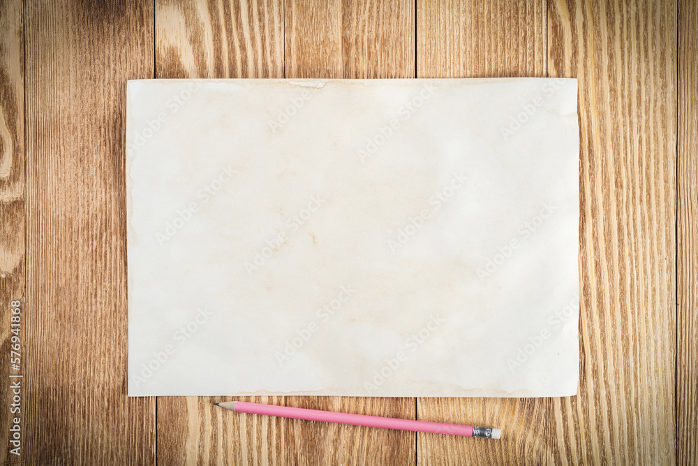 Sheet of paper lying on wooden table