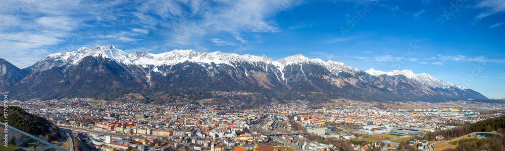 Panoramic view of Innsbruck with snow mountain range in the background in winter 