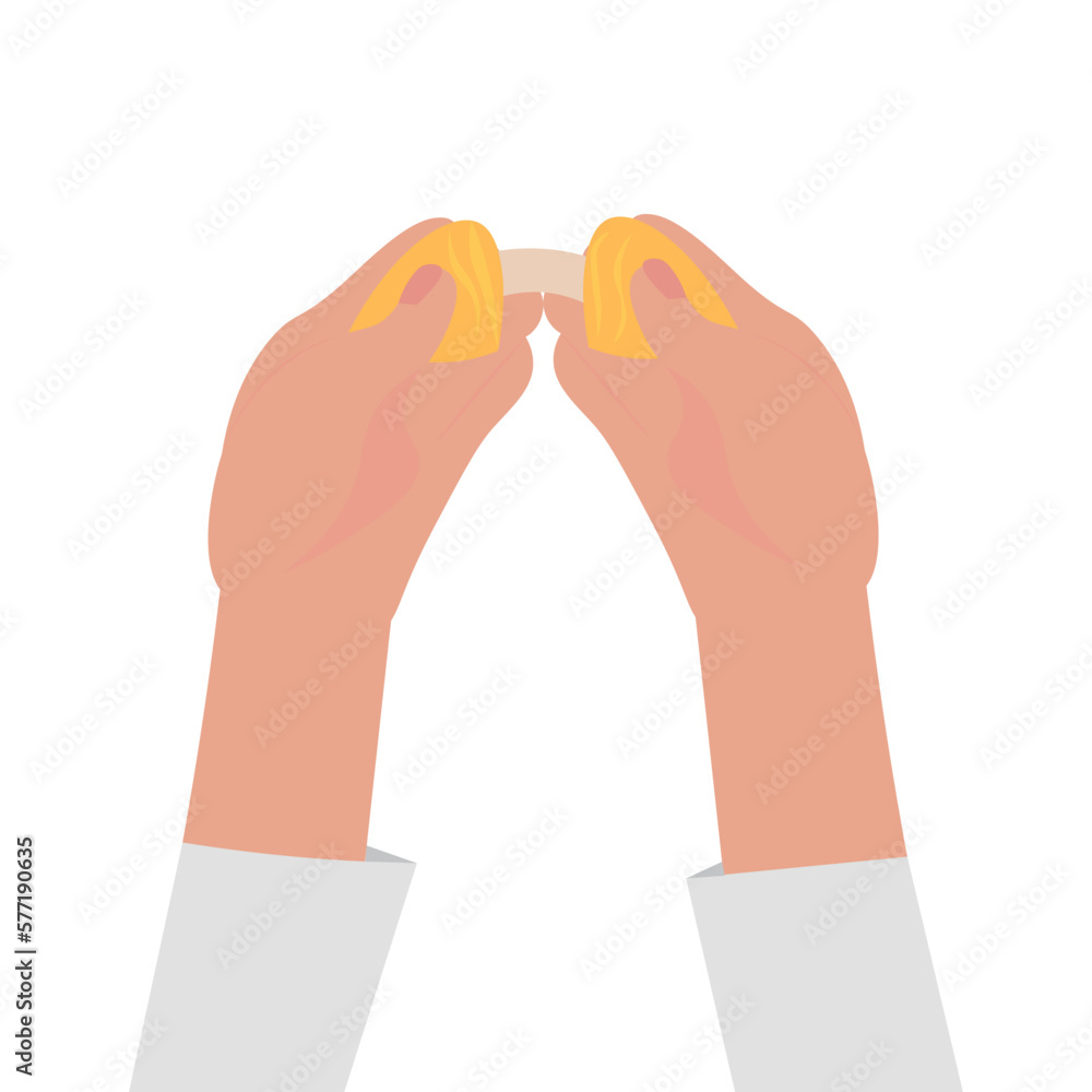 Female hands breaking fortune cookie on white background