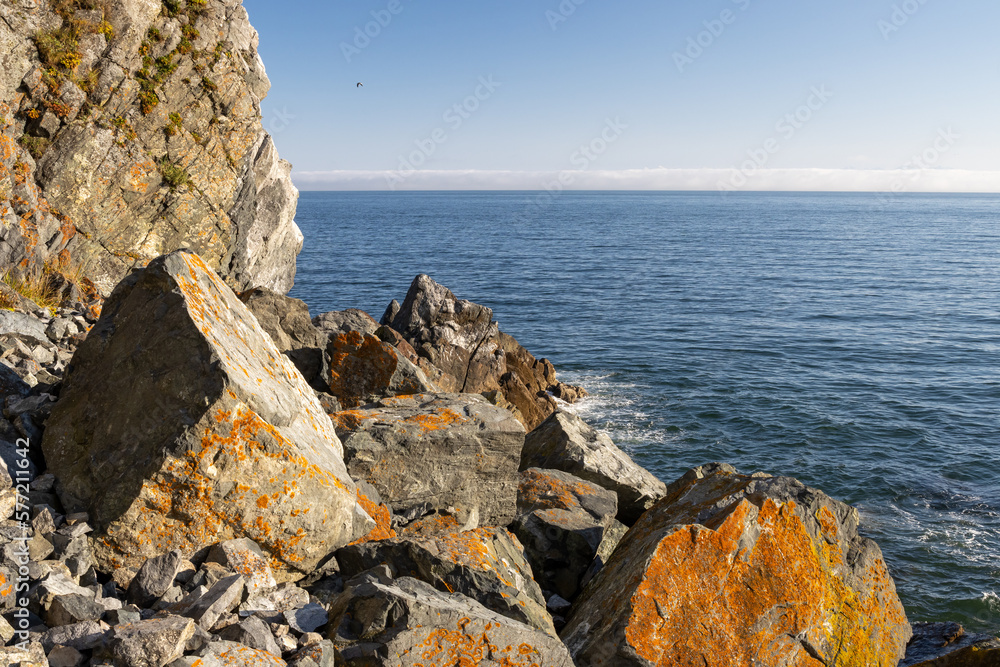 Beautiful seascape. View of the rocky coast and the sea. There is no one on the rocky shore. Large s