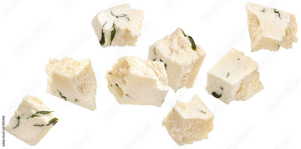 Falling feta pieces isolated on white background