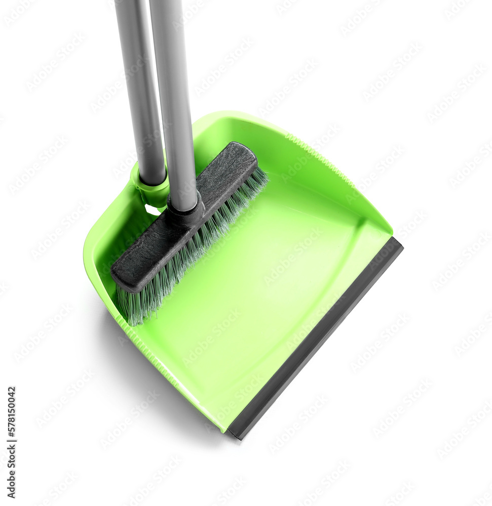 Cleaning broom with dustpan on white background