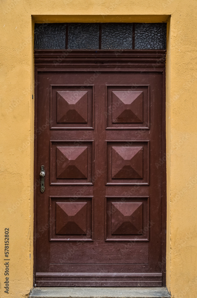 View of old building with wooden door