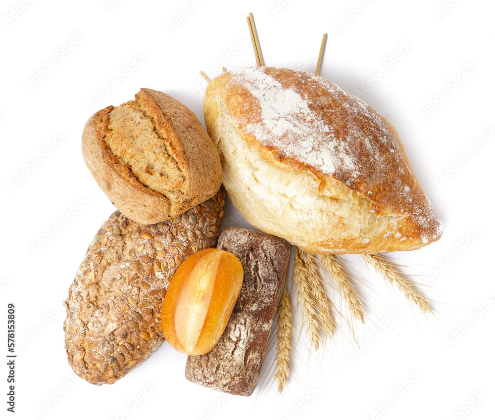 Loaves of different bread and wheat ears isolated on white background