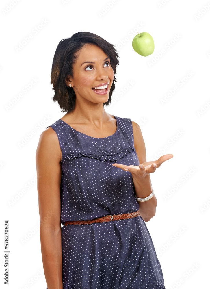 An African girl, who is in good health, throwing an apple in the air while promoting organic fruits 