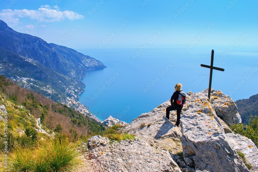 Woman hiker watching beautiful costal scenery - Path of the Gods  Sentiero degli Dei  the famous hik