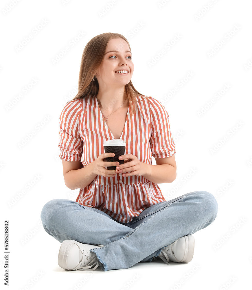 Beautiful girl with cup of coffee sitting on white background