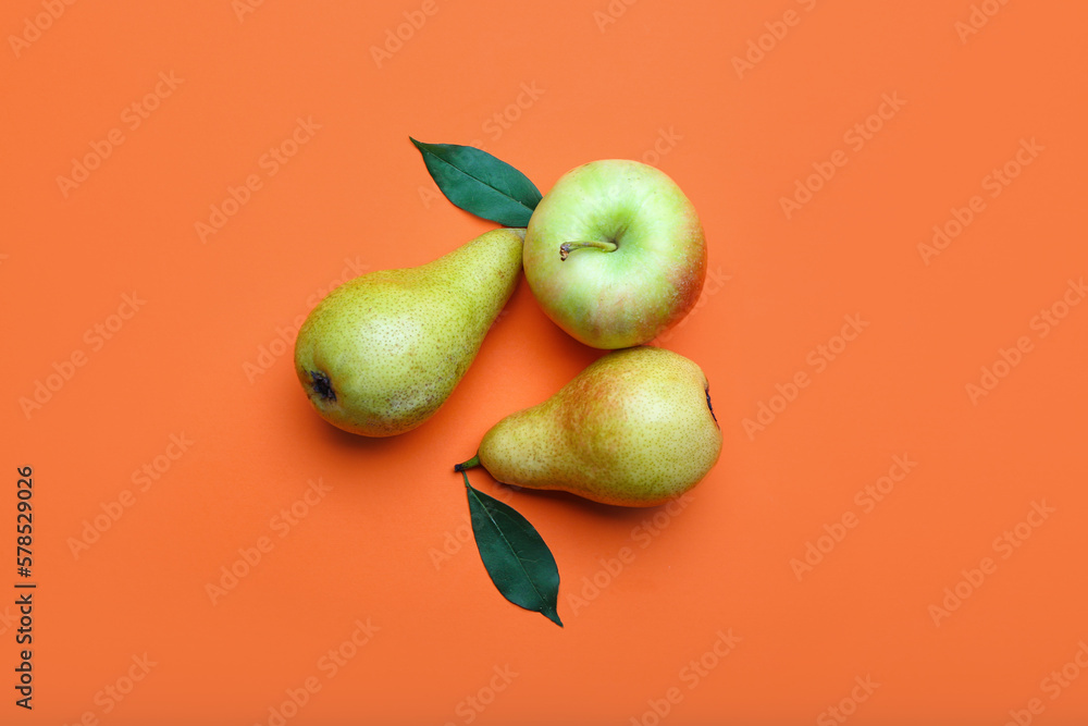 Fresh pears and apple on color background