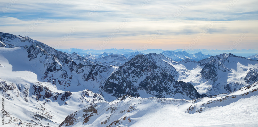 Panoramic view of Alps mountain snowy range with skiing trails, Stubai Glacier, Austria