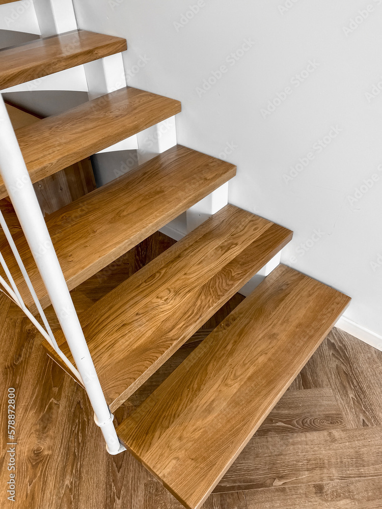 View of wooden steps in light room