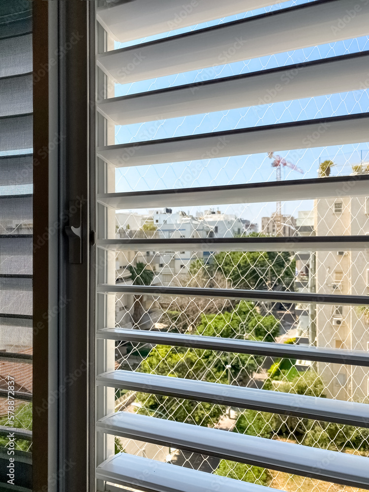 Window with blinds in room, closeup