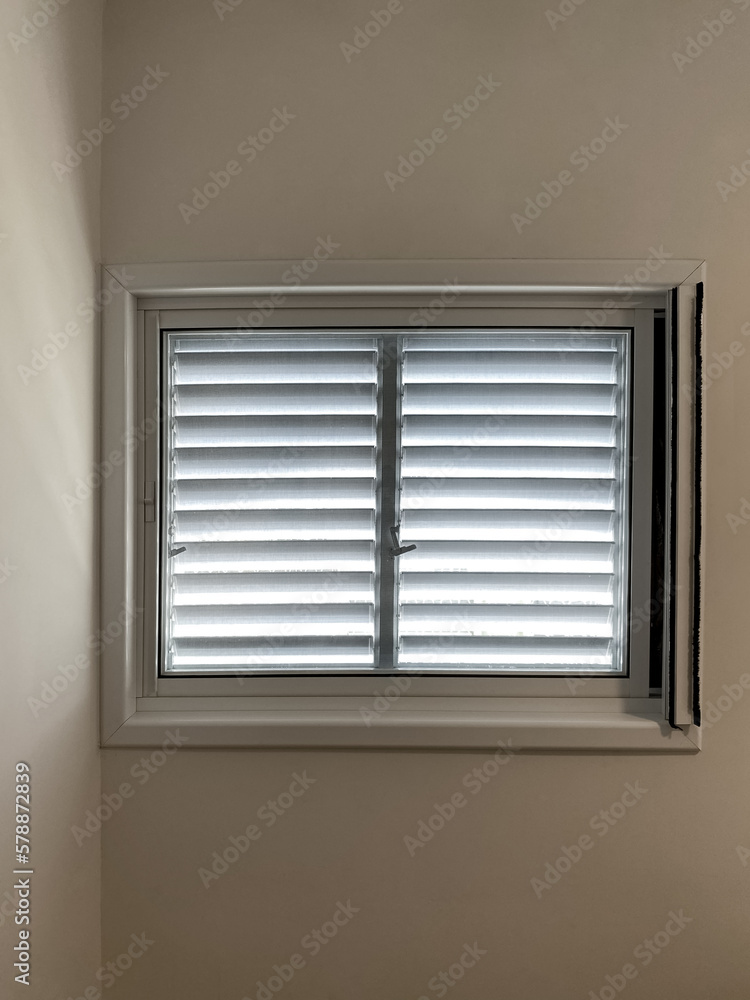 View of window with blinds in room