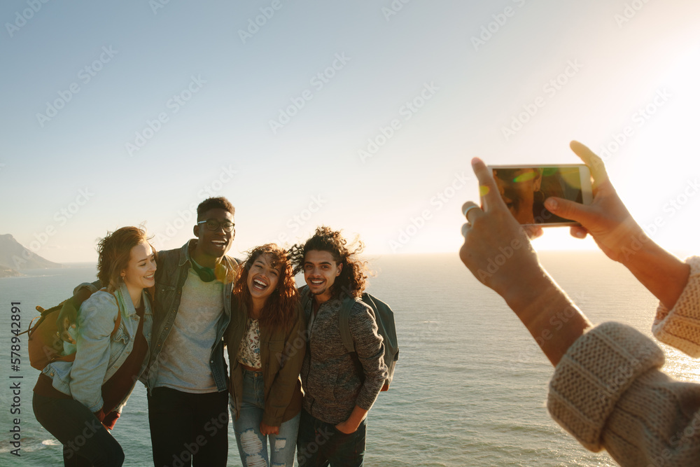 Group of friends taking pictures on their holiday