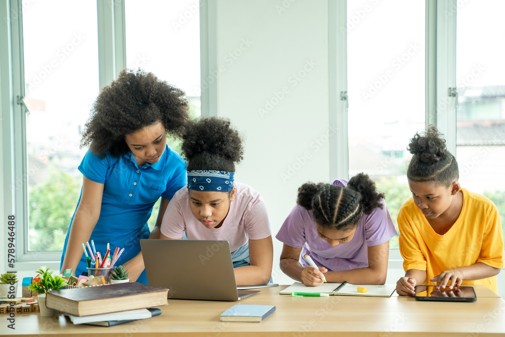 Elementary school children using digital tablet in classroom,Education,Wireless technology and schoo