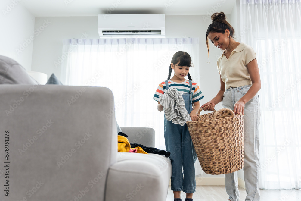 Happy family, Caucasian mother teach daughter cleaning in living room. 