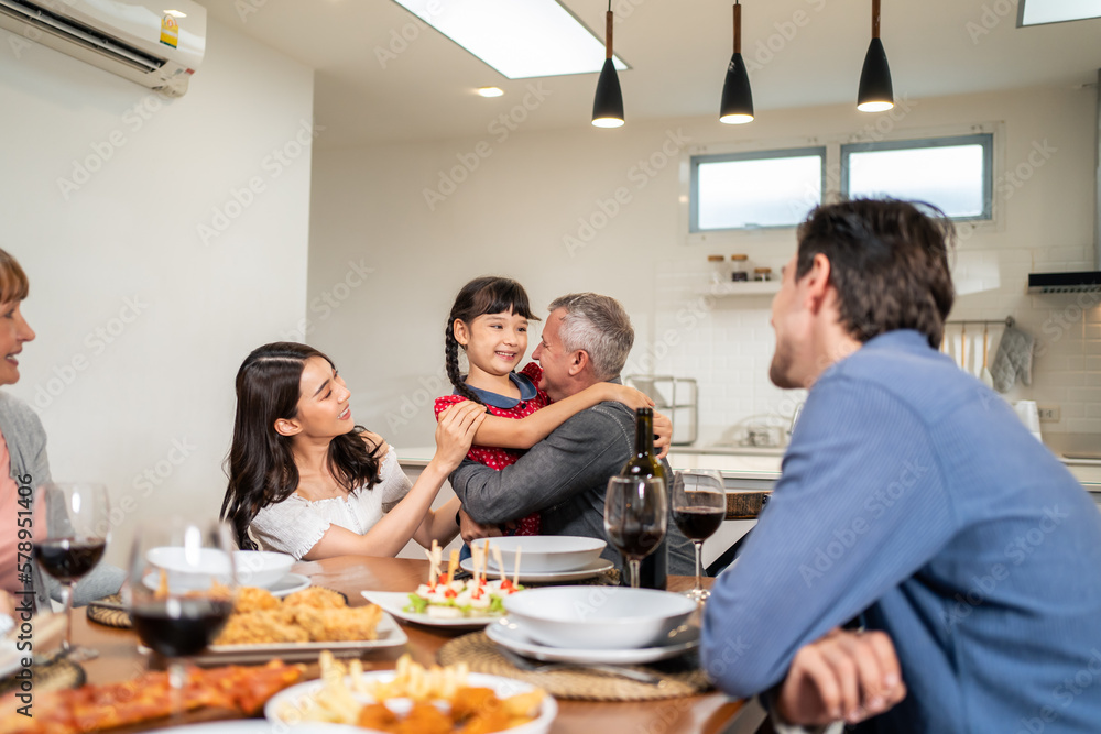 Young couple and adorable daughter visit family during holiday vacation. 