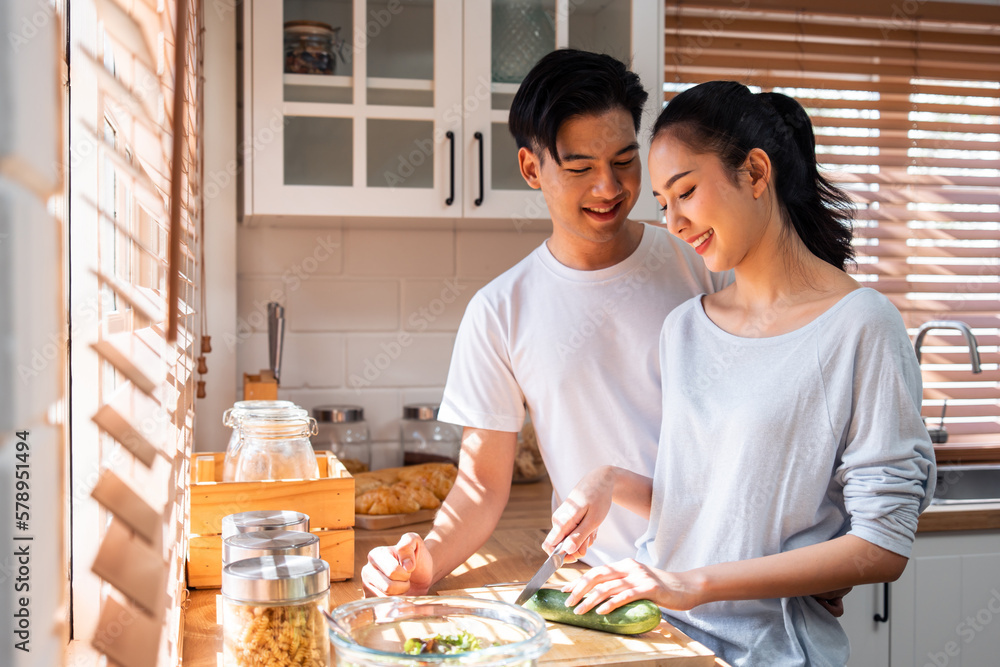 Asian young new marriage couple spend time together in kitchen at home. 