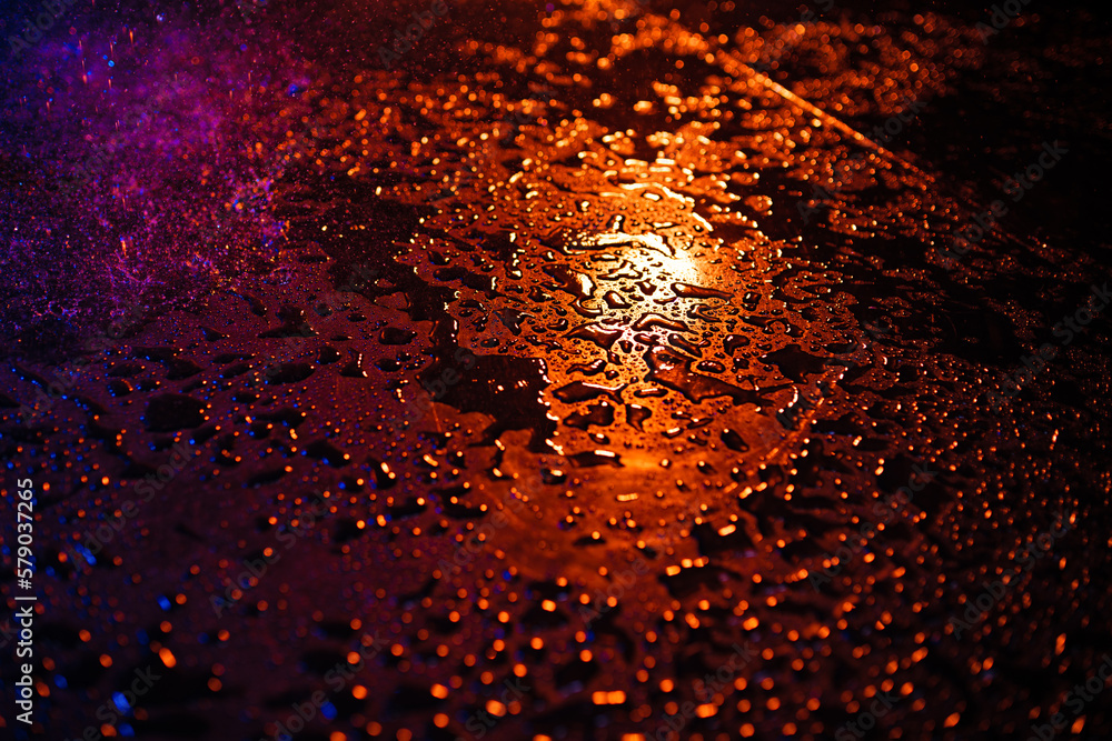 Abstract wet surface with red and blue lights