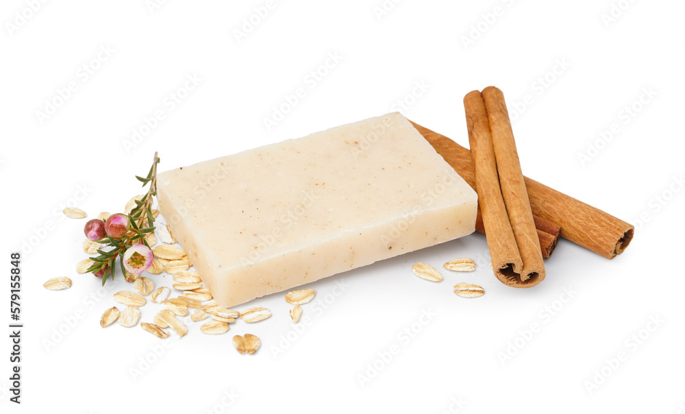 Soap bar and natural ingredients on white background