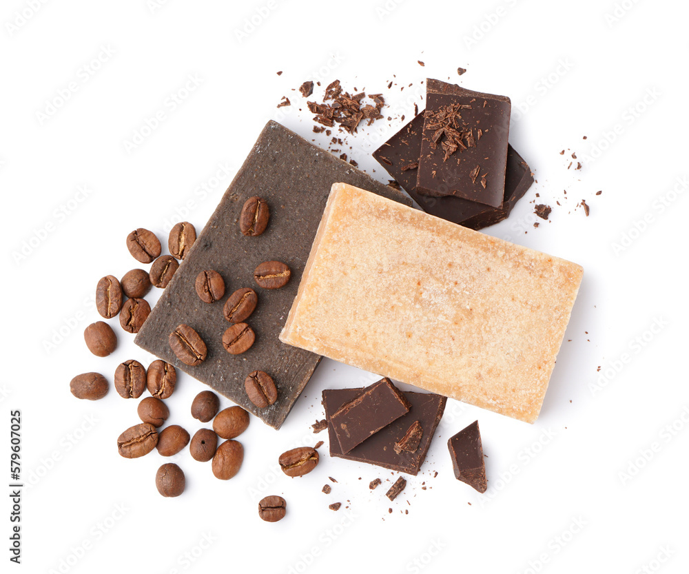 Natural soap bars, dark chocolate and coffee beans on white background