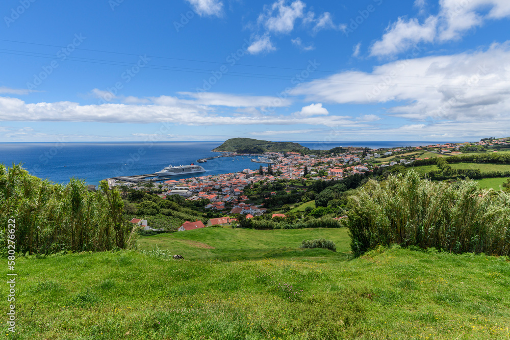 View over Horta, there is a cruise ship in the harbour / View over the city of Horta on the island o