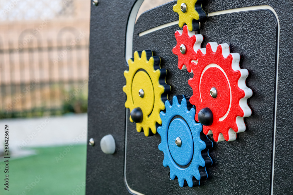 Toy car with gears on childrens playground, closeup