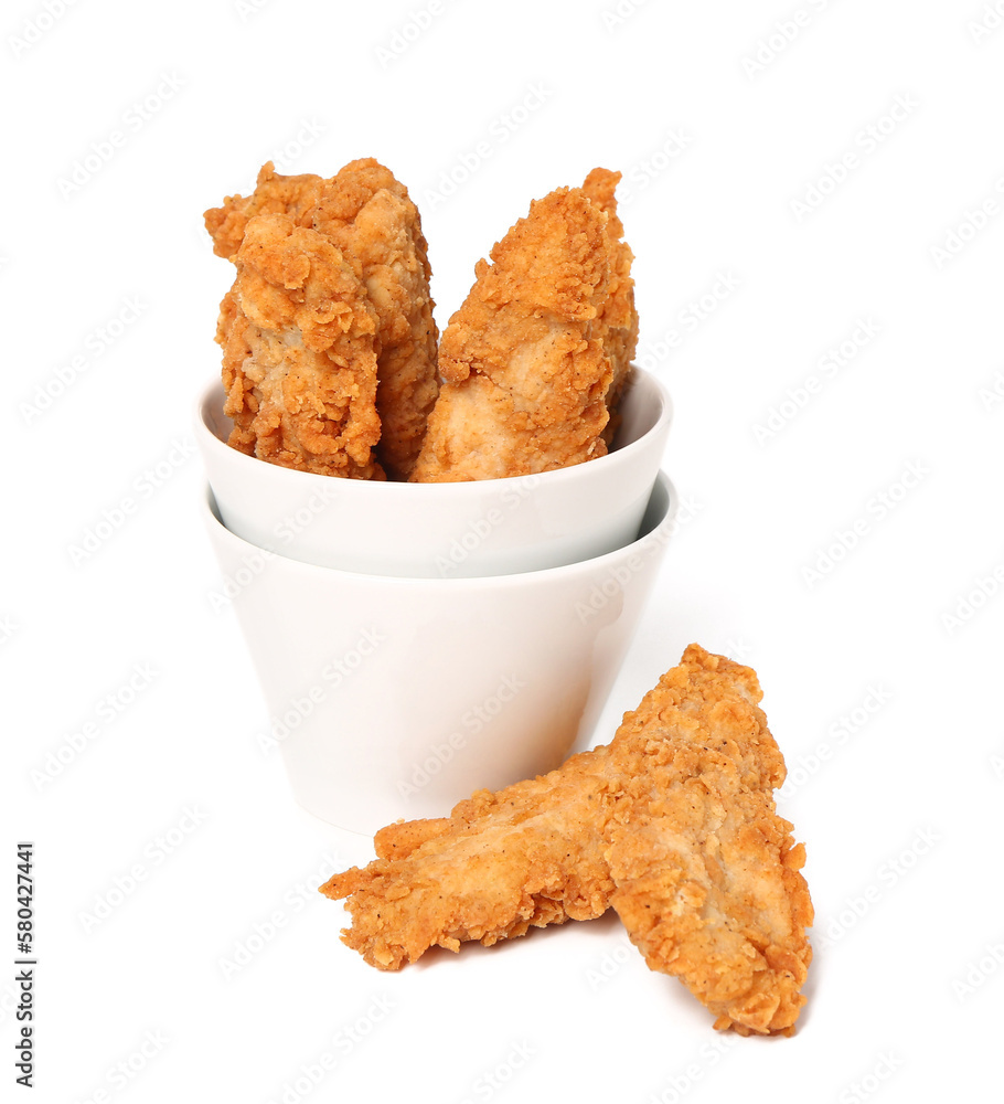 Bowl of tasty nuggets on white background