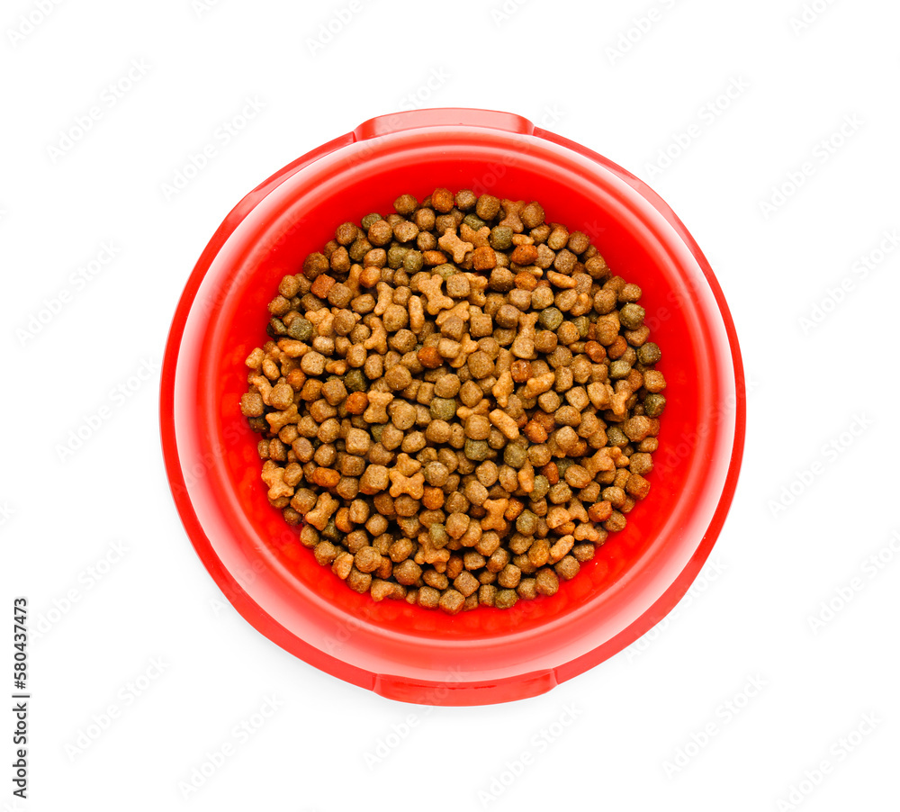 Red bowl of dry pet food on white background, closeup