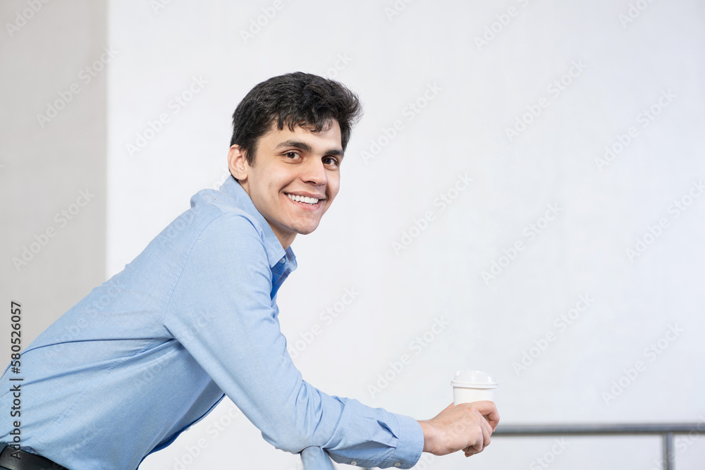 close-up portrait of a man with coffee