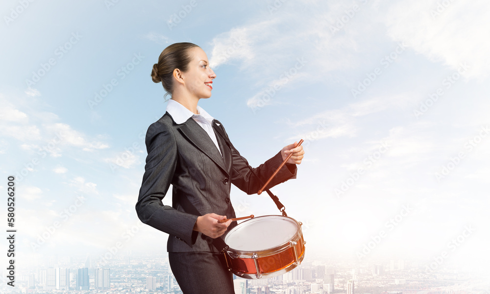 Young business woman with a drum