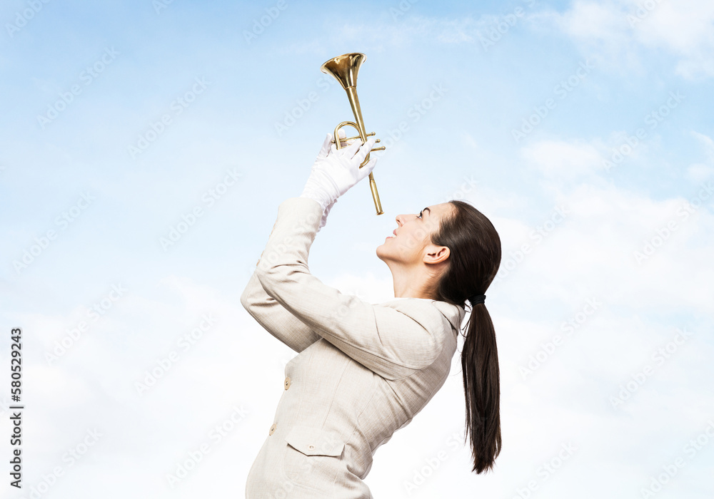 Beautiful woman playing trumpet brass