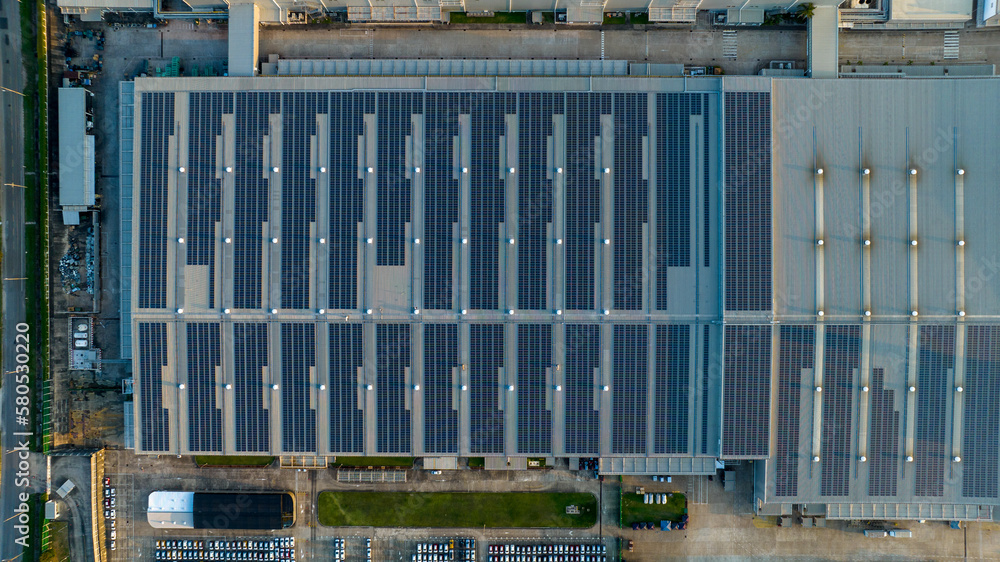 Top view Solar Panels on Warehouse Factory. Solar photo voltaic panels system power or Solar Cell on