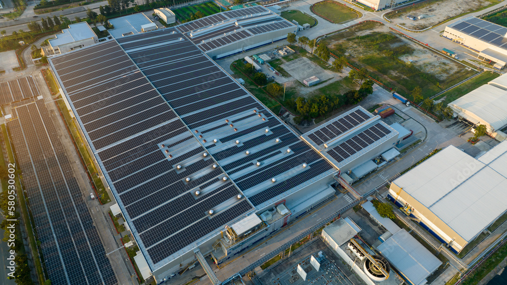 Top view Solar Panels on Warehouse Factory. Solar photo voltaic panels system power or Solar Cell on