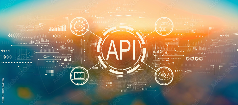 API - application programming interface concept with blurred cityscape at sunset or sunrise