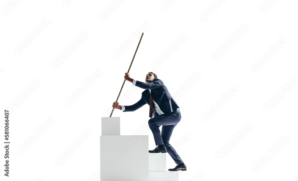 Ambitious young businessman working his way to the top of a block of stairs on a transparent backgro