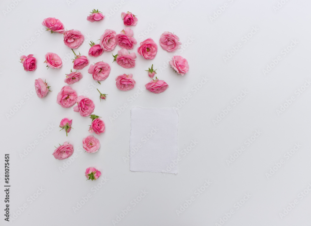 Feminine vertical birthday mock-up scene. Blank paper greeting pink roses, peony flowers on white ta