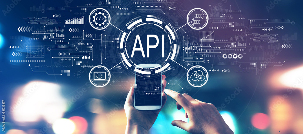 API - application programming interface concept with blurred city lights at night