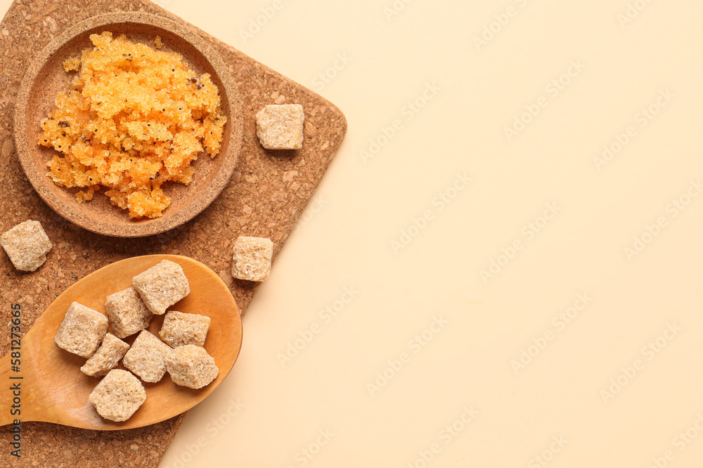 Plate of body scrub and cane sugar on color background