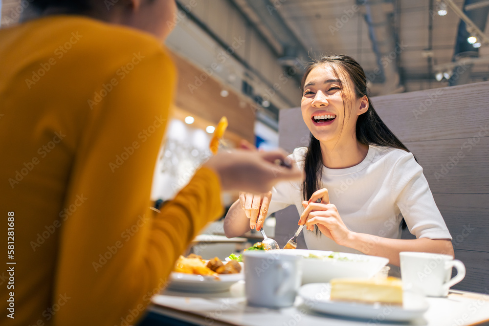 Asian beautiful women having dinner with friend in restaurant together. 