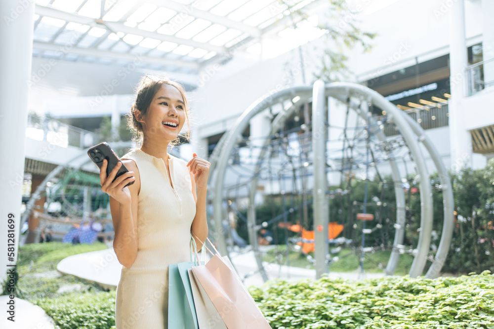 Asian beautiful young woman shopping goods outdoor in department store. 