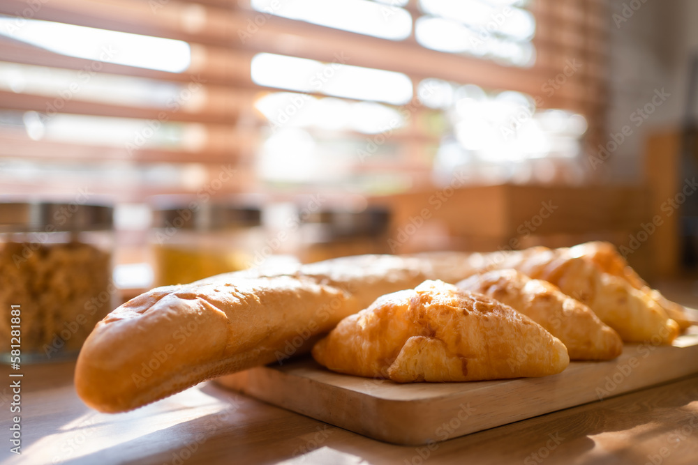 Close up of many types of delicious fresh bread in the kitchen room.