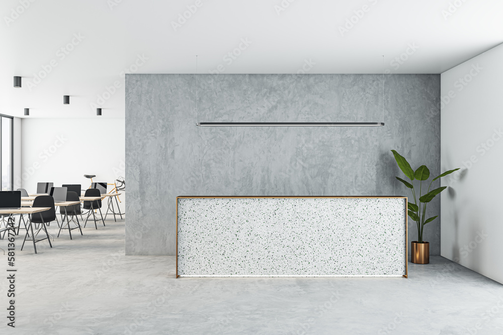 Front view on blank reception desk with space for product presentation on light concrete floor, grey