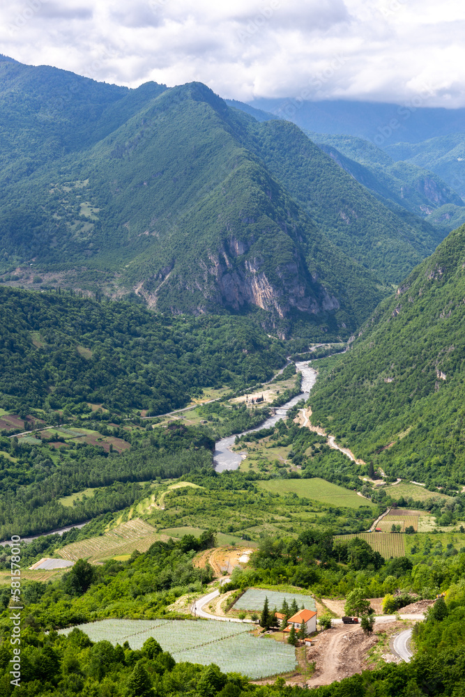 Tskhenistsqali river valley landscape in Racha region of Georgia with Svaneti mountain range, lush g