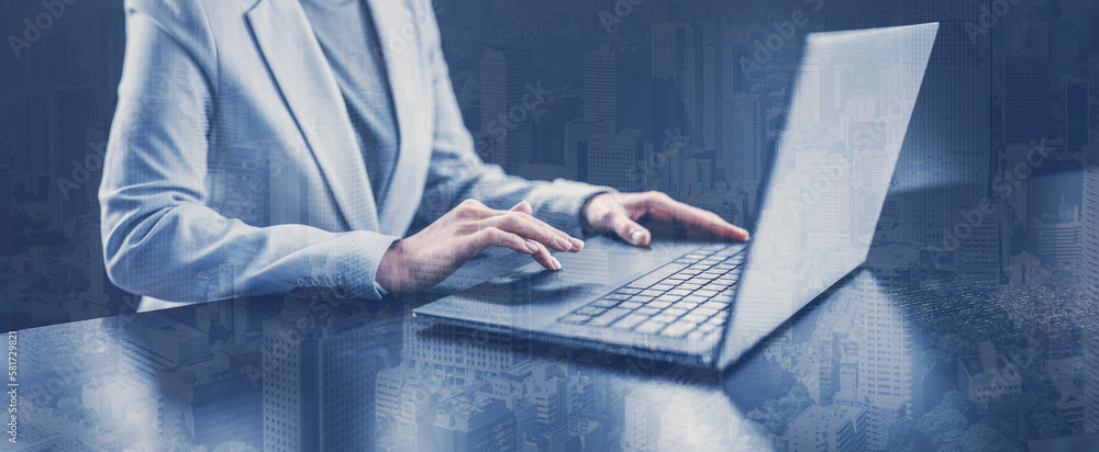 Woman with her laptop in the office and working.