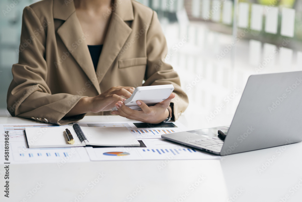 Businesswoman working with financial accounting documents in the office.