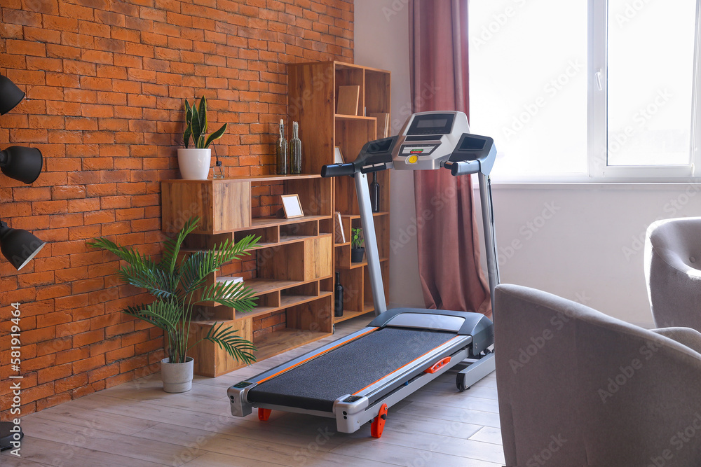 Interior of living room with modern treadmill