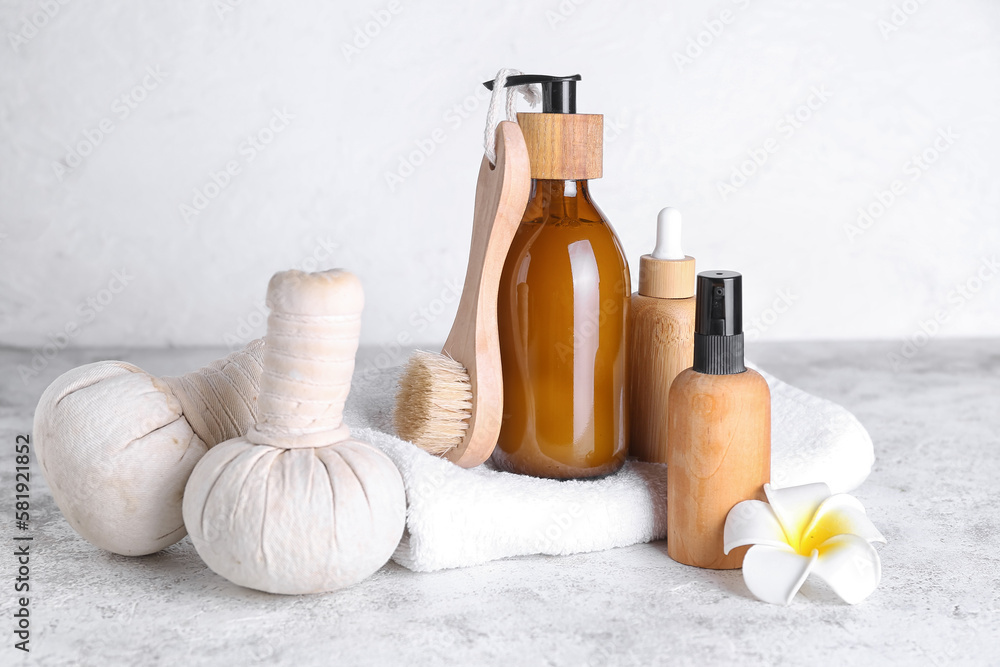 Set of cosmetic products and bath supplies on light background