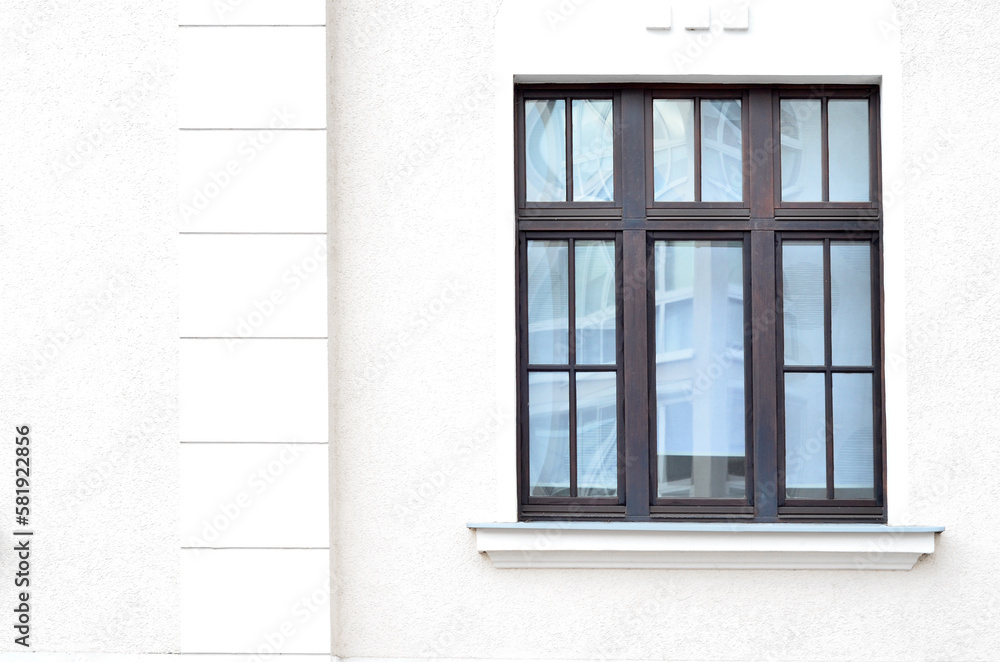 View of white building with wooden window