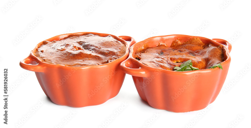 Delicious meat pies in baking forms isolated on white background